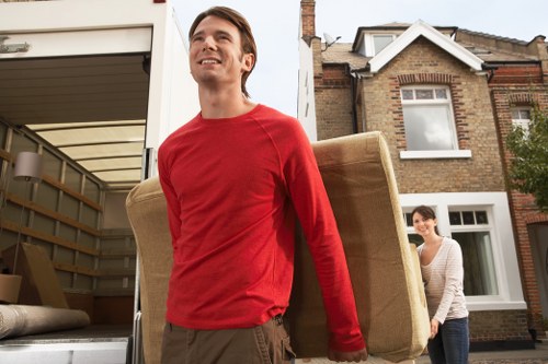 Removal team planning a move in a Bromley residential street