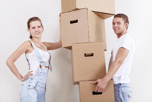 Packed moving boxes and furniture ready for local transport
