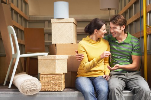 Unpacking boxes and arranging rooms in a Bromley home after moving