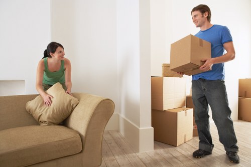 Furniture and boxes being loaded into a removals van