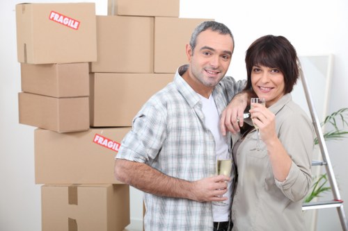 Trained movers handling furniture carefully during a Bromley removal